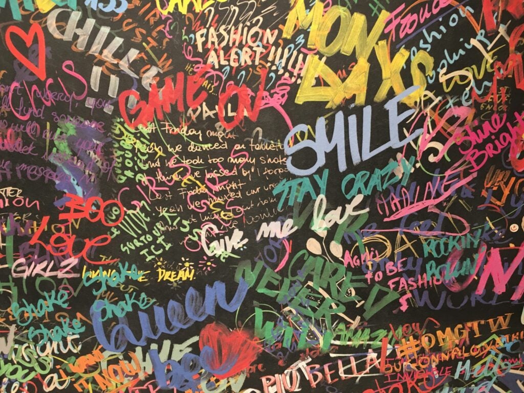 A word wall with things like Smile, Game On and Queen standing out