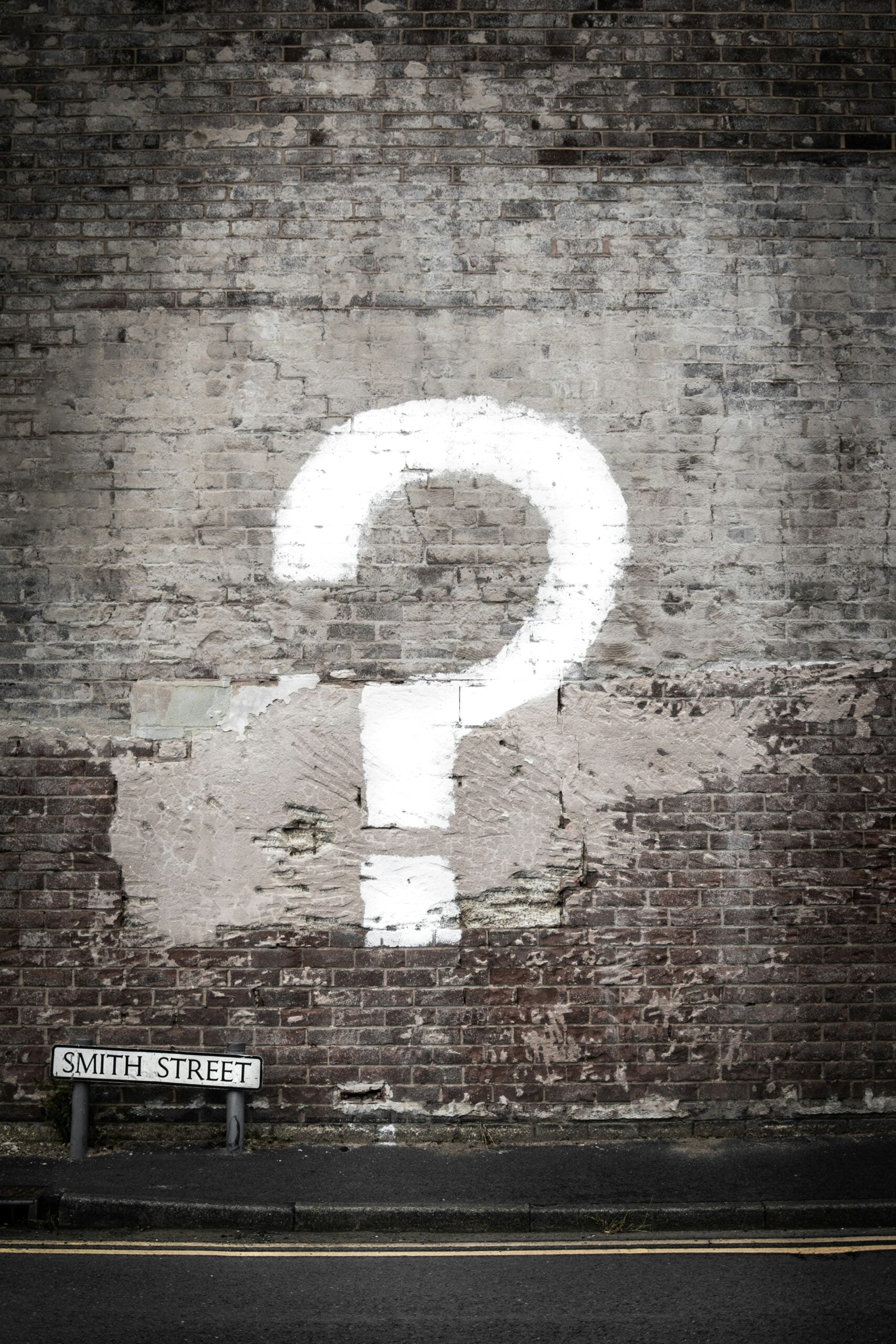 A question mark painted on a wall